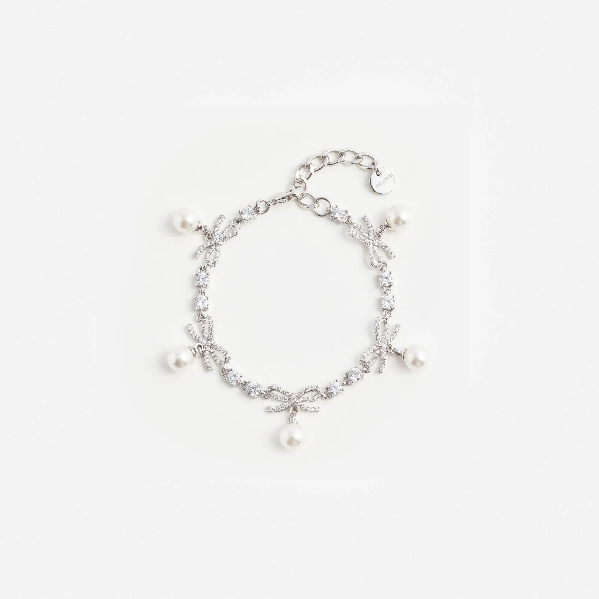 CRYSTAL BOW PEARL CHARM BRACELET